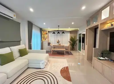 Spacious modern living room with elegant decor and open layout, perfect for family gatherings.