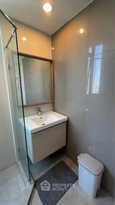Modern bathroom with sleek design and glass shower partition