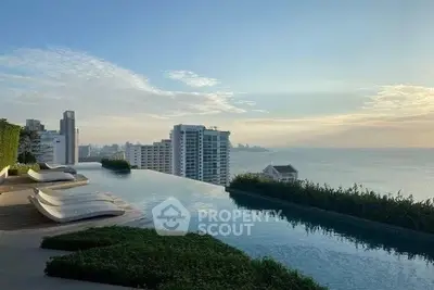 Luxurious rooftop infinity pool with stunning ocean and city skyline views.