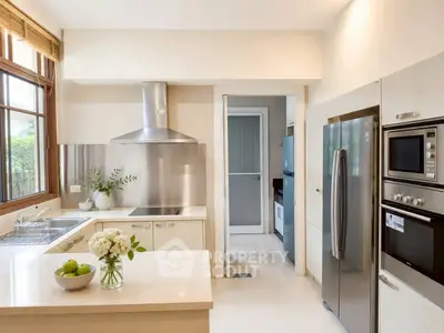 Modern kitchen with stainless steel appliances and elegant design