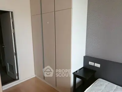 Modern bedroom with sleek wardrobe and minimalist design