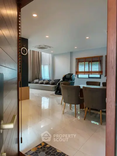Spacious modern living room with elegant decor and ample natural light