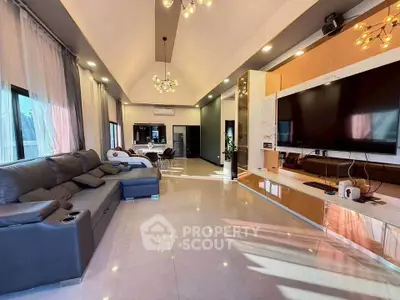 Luxurious modern living room with sleek design and spacious layout, featuring a large sectional sofa and elegant lighting.