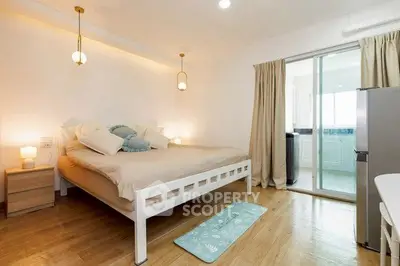 Spacious bedroom with modern decor and natural light