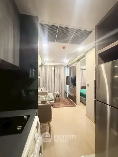 Modern apartment interior with open kitchen and cozy living area