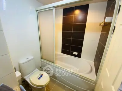 Modern bathroom with sleek bathtub and stylish tile design