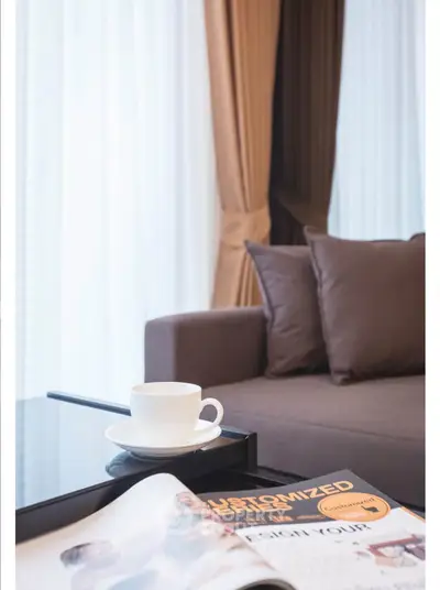 Stylish living room with modern sofa and coffee table, perfect for relaxation and entertaining guests.