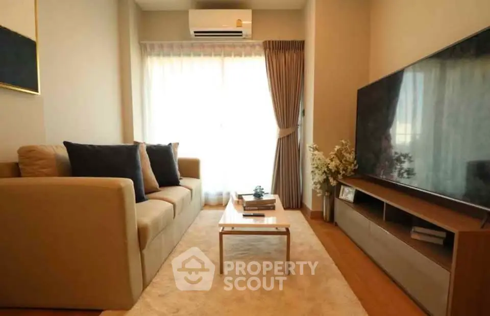 Cozy modern living room with large TV and elegant decor