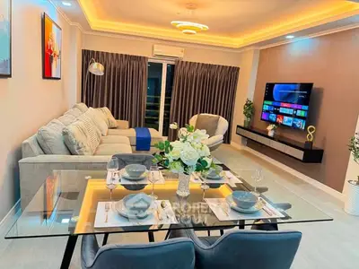 Luxurious modern living room with elegant dining area and wall-mounted TV, perfect for entertaining.