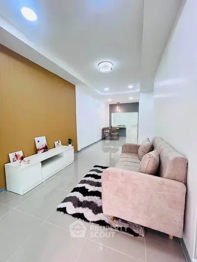 Spacious modern living room with stylish decor and open layout, perfect for relaxation and entertaining.