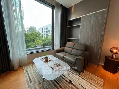 Modern living room with large window and stylish furniture in urban apartment