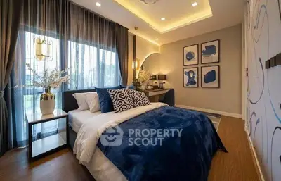 Luxurious bedroom with modern decor and ambient lighting, featuring a cozy bed and stylish artwork.