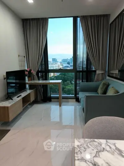 Modern living room with city view, sleek furniture, and elegant decor