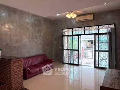 Spacious living room with modern design and large windows for natural light.