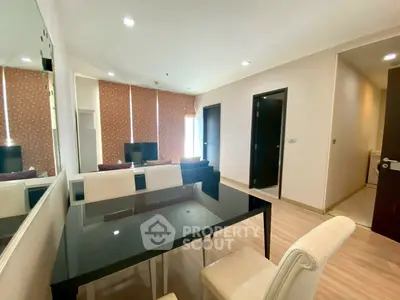 Modern living room with elegant dining area and natural light