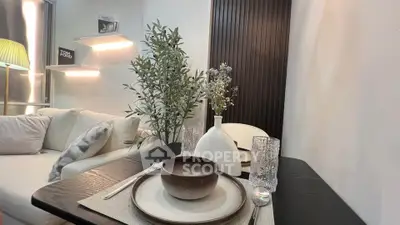 Stylish modern living room with elegant dining setup and cozy seating area.