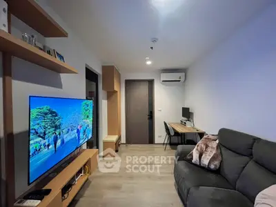Modern living room with sleek TV setup and cozy seating area