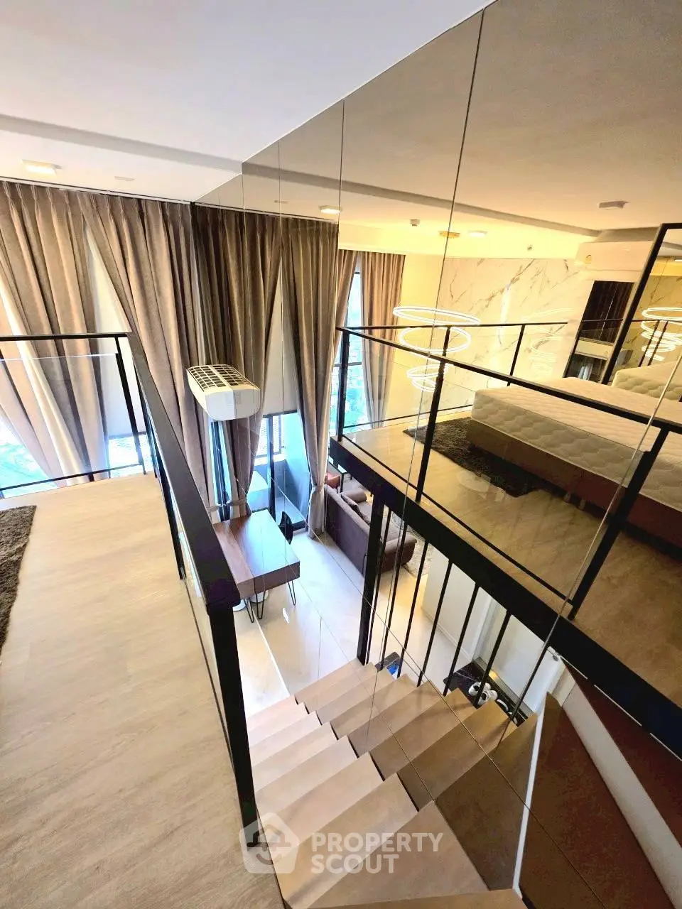 Luxurious modern loft with elegant staircase and stylish decor