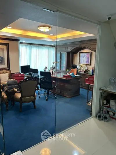 Luxurious home office with elegant furniture and glass partition