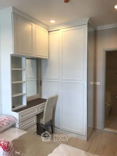 Modern bedroom with built-in wardrobe and cozy decor