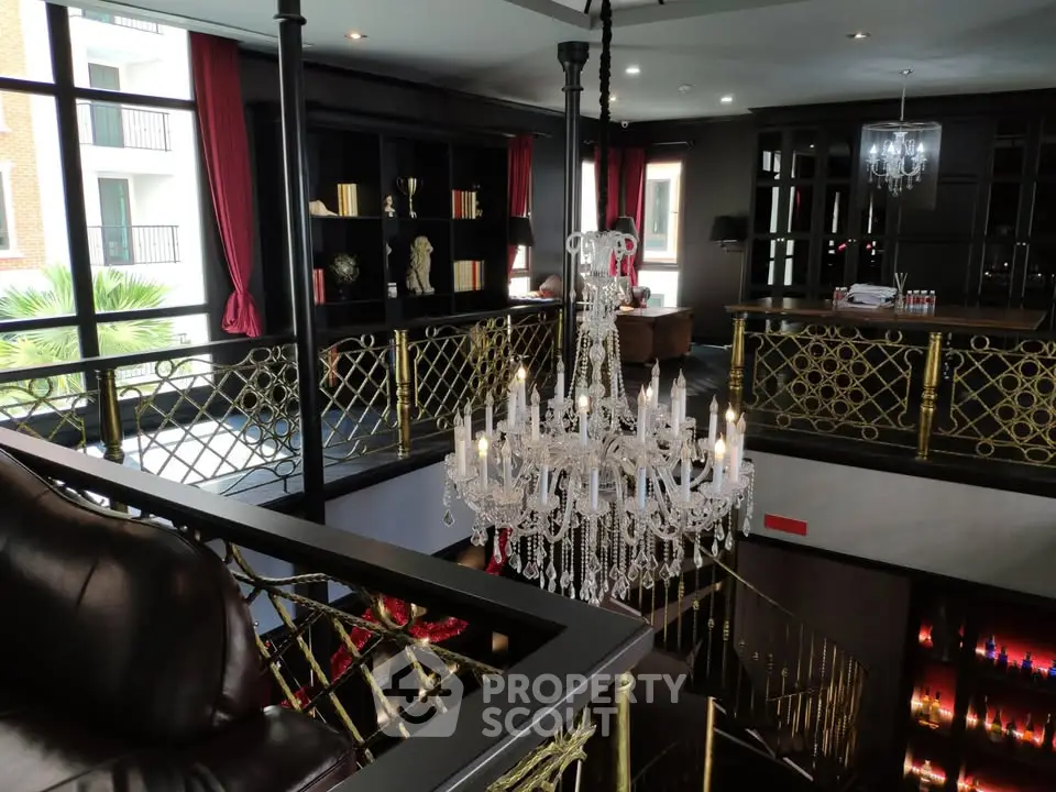 Luxurious two-story living room with elegant chandelier and stylish decor