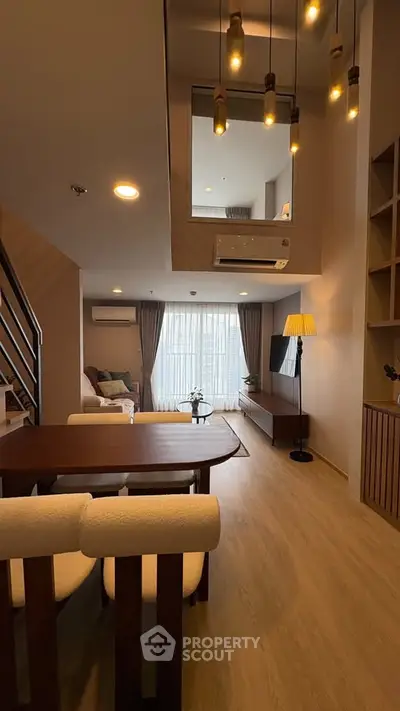 Modern living room with stylish lighting and cozy seating area