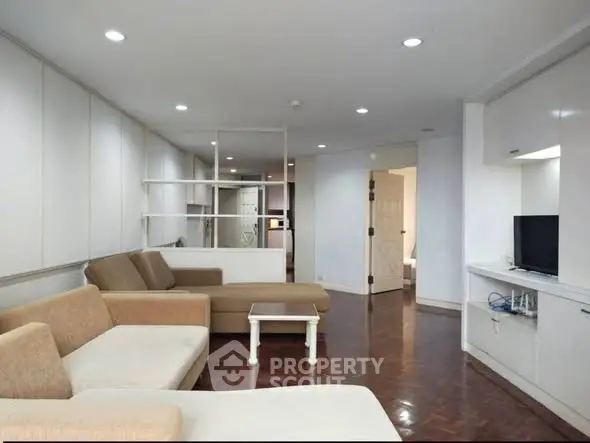 Spacious modern living room with stylish furniture and elegant lighting