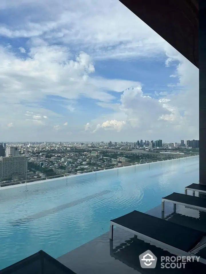 Stunning rooftop infinity pool with panoramic city skyline view