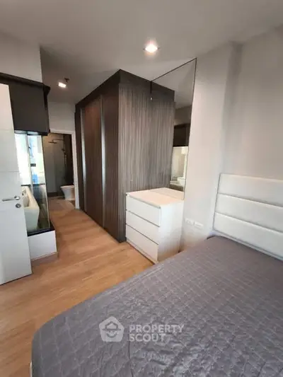 Modern bedroom with sleek design and ample storage space