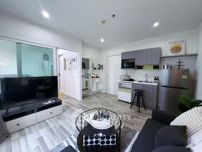 Modern open-plan living room with sleek kitchen and stylish decor