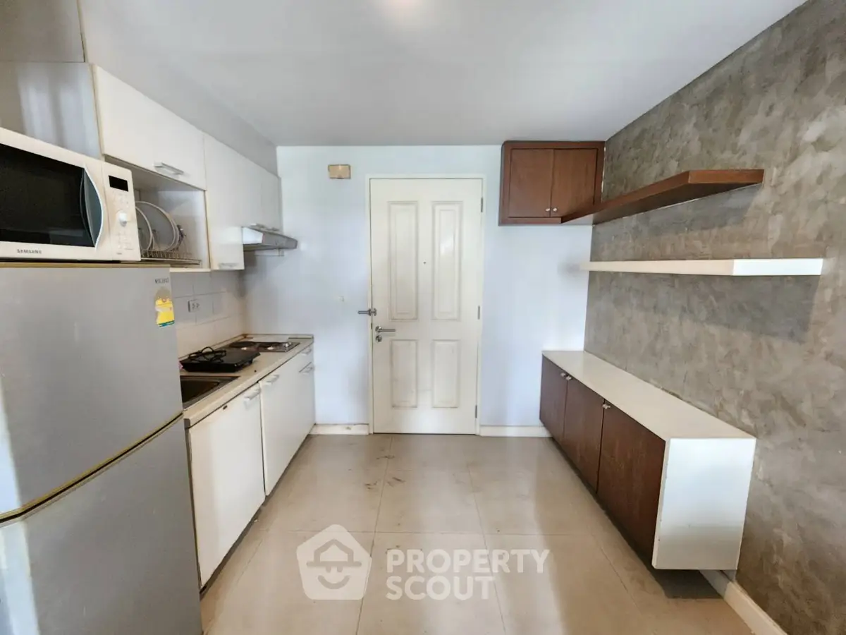 Modern kitchen with sleek appliances and minimalist design