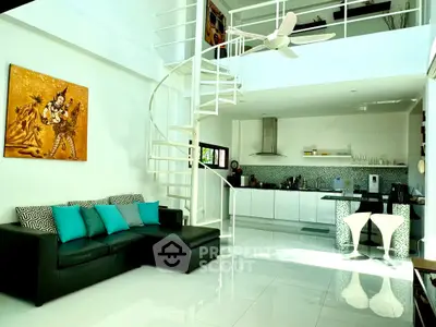 Stunning modern living room with spiral staircase and open kitchen layout, featuring sleek design and vibrant decor.