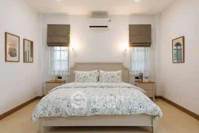 Cozy bedroom with floral bedding and modern decor