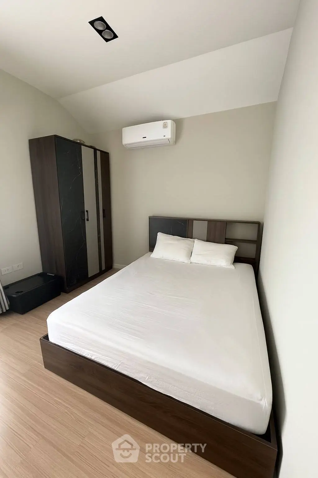 Modern bedroom with minimalist design and air conditioning