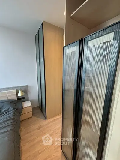 Modern bedroom with sleek wardrobe and stylish decor