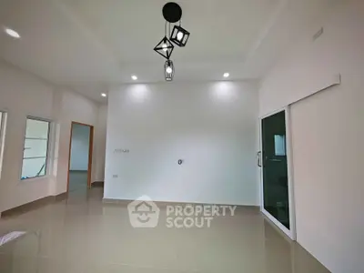 Spacious modern interior with sleek lighting and glossy tiled floors