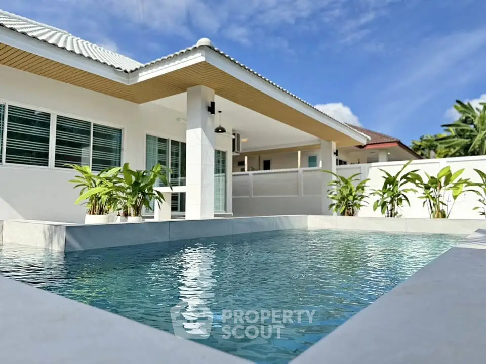 Luxurious modern home with private pool and tropical landscaping