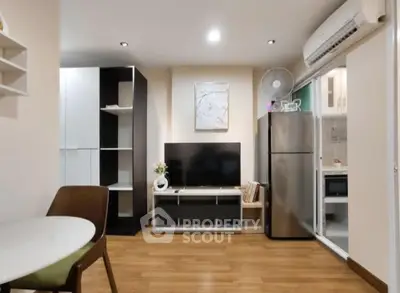 Modern living room with sleek furniture and open kitchen layout