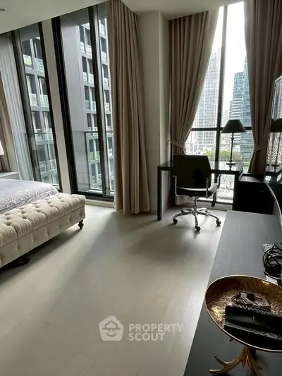 Luxurious bedroom with city view, modern decor, and ample natural light.