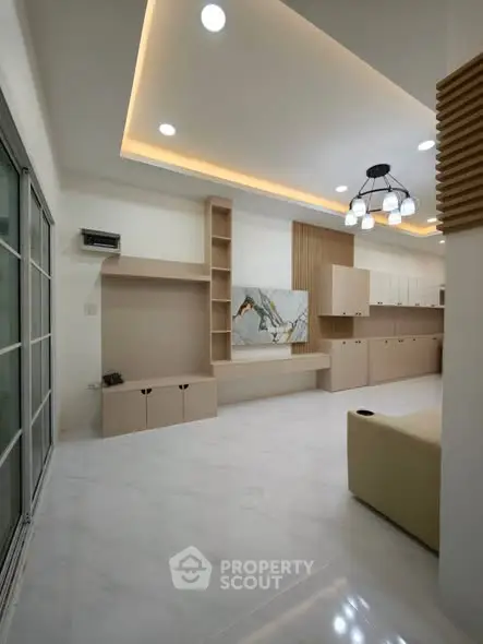 Modern living room with elegant lighting and built-in storage solutions