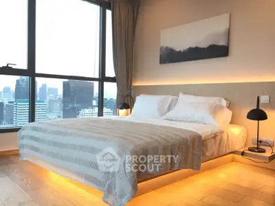 Luxurious bedroom with stunning city view and modern lighting