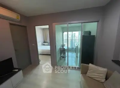 Modern apartment interior with living room, bedroom, and balcony view.