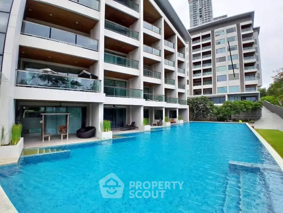 Luxurious apartment complex with stunning pool and modern architecture