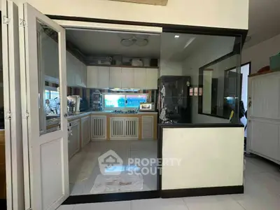 Spacious kitchen with modern design and ample storage in a stylish home.
