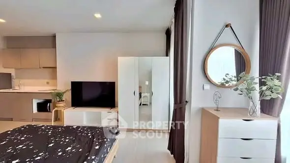 Modern bedroom with stylish decor and open kitchen layout