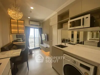 Modern apartment interior with open kitchen, dining area, and balcony view.