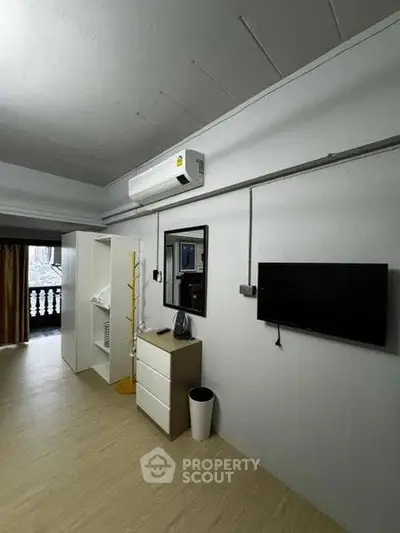 Modern bedroom with air conditioning and minimalist decor