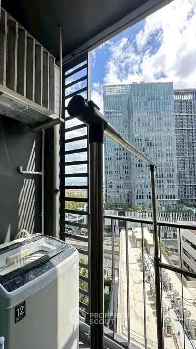 Modern balcony with washing machine and city view, perfect for urban living.