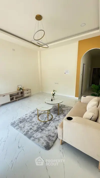 Modern living room with elegant decor and cozy seating area