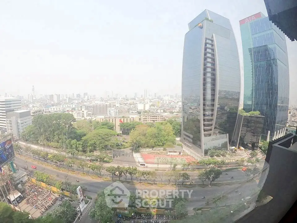 Stunning cityscape view with modern skyscrapers and lush greenery, perfect for urban living enthusiasts.